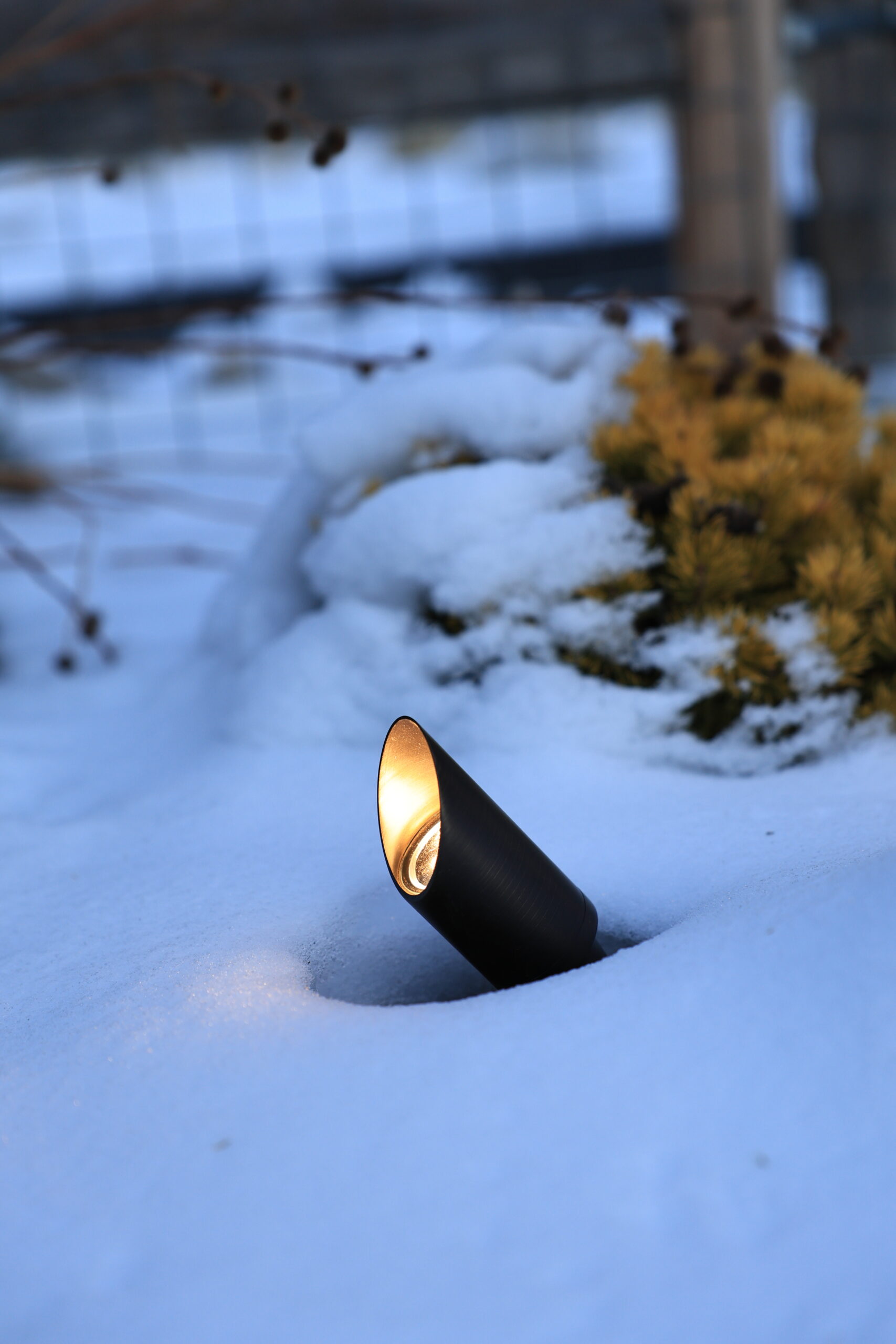 Bronze Landscape lighting up light in the snow installed by Night Vision