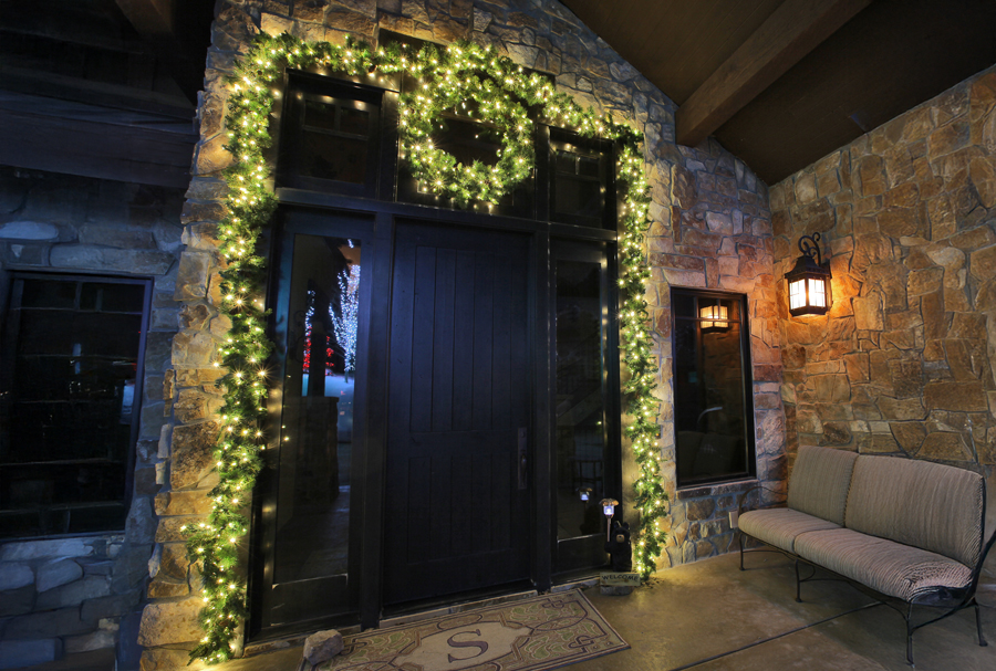 A stone structure with a door and bench, marked "Night Vision Lighting & Electric" for enhanced nighttime visibility.<br />